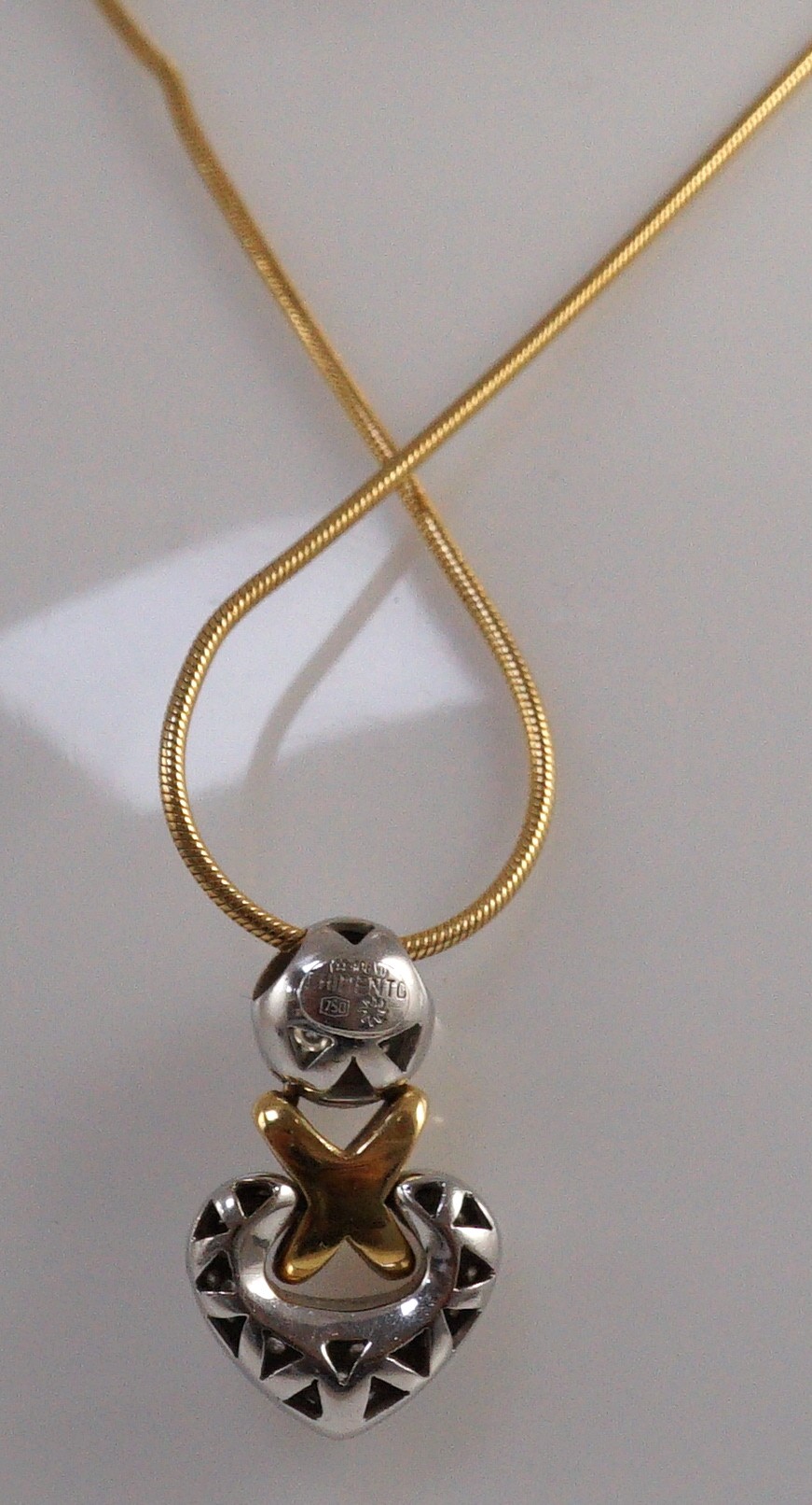 A cased modern Italian 18ct two colour gold and pave set diamond heart shaped pendant by Chimento, on an 18ct gold snake link chain